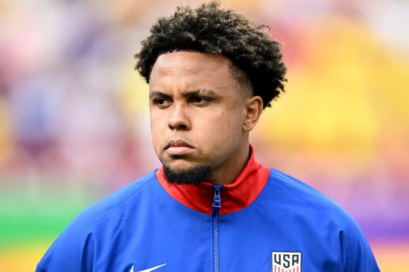 Weston McKennie #8 of the United States stands