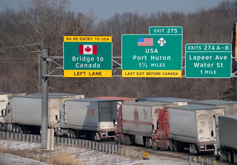 After the Ambassador Bridge was closed due to Canadian anti-vaccine protests, traffic was diverted to the Blue Water Bridge in Port Huron,  causing miles-long backups on Feb. 9, 2022. From an overpass, the Interstate 94 approach to the Blue Water Bridge heading to Canada was packed with transfer trucks.