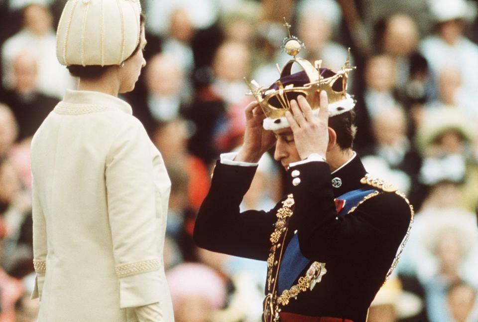 Queen Elizabeth II crowns Prince Charles, the Prince of Wales