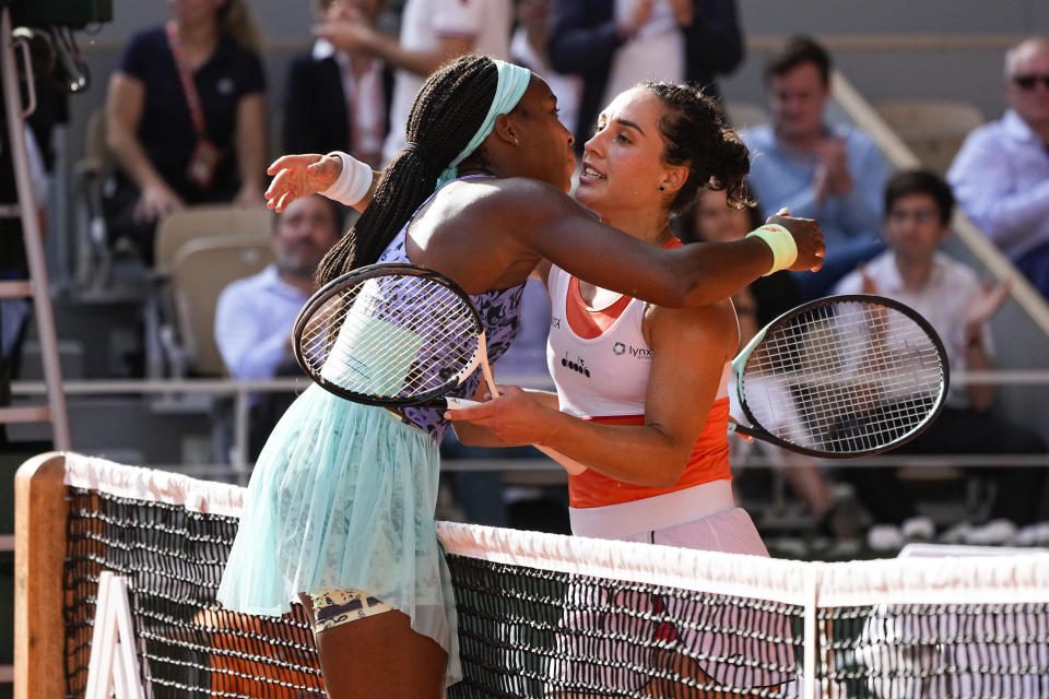 Coco Gauff of the U.S., left, is congratulated by Italy's Martina Trevisan after Gauff won the semifinal match in two sets, 6-3, 6-1, at the French Open tennis tournament in Roland Garros stadium in Paris, France, Thursday, June 2, 2022. (AP Photo/Michel Euler)