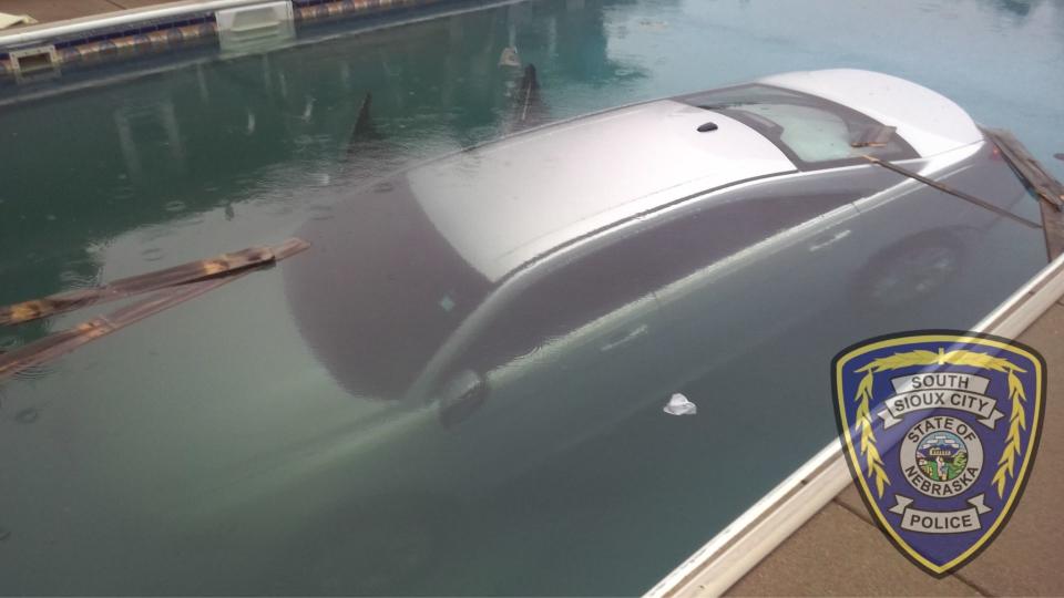Ford Taurus Driver Parks In Backyard Pool