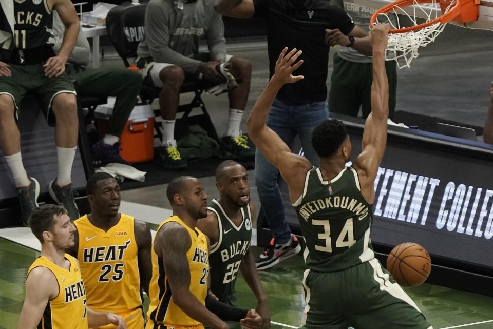 Milwaukee Bucks' Giannis Antetokounmpo dunks during the first half of Game 1 of their NBA basketball first-round playoff series against the Miami Heat Saturday, May 22, 2021, in Milwaukee. (AP Photo/Morry Gash)