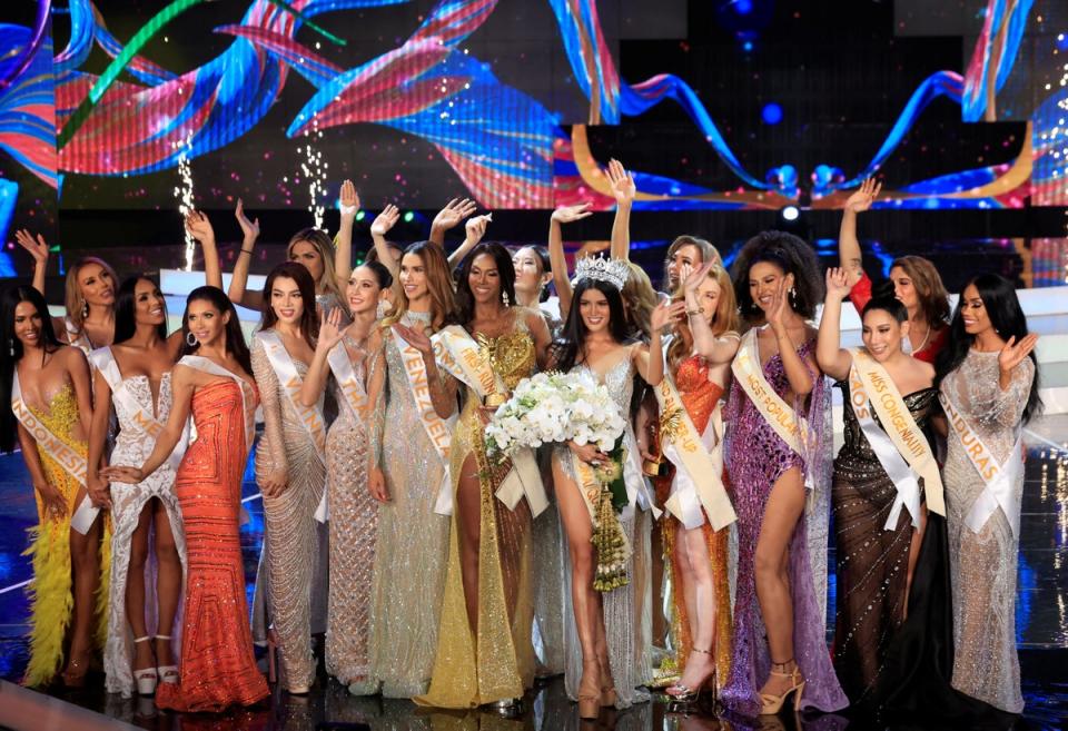 Ravena poses with other contestants after winning the finale (REUTERS)