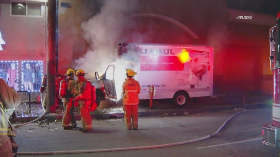 A U-Haul truck burst into flames after sideswiping a car and careening into a building in the Adams-Normandie neighborhood of South Los Angeles on May 8, 2024. (KNN)