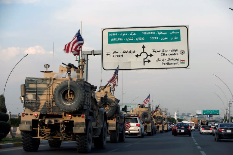 A convoy of U.S. vehicles is seen after withdrawing from northern Syria, in Erbil