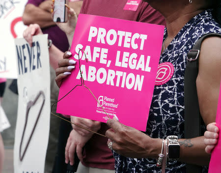 FILE PHOTO: A pro-choice activist holds a sign in downtown Memphis during a "Stop Abortion Bans Day of Action" rally hosted by the Tennessee chapter of Planned Parenthood in Tennessee, U.S., May 21, 2019. REUTERS/Karen Pulfer Focht