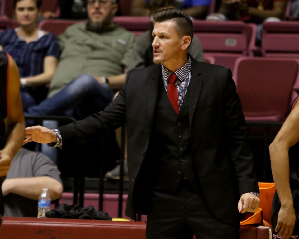 Wichita Falls High School head basketball coach Mark Malone talks to his players in the Wichita Falls Classic game against Hirschi Saturday, Dec. 1, 2018, in D.L. Ligon Coliseum at Midwestern State University.