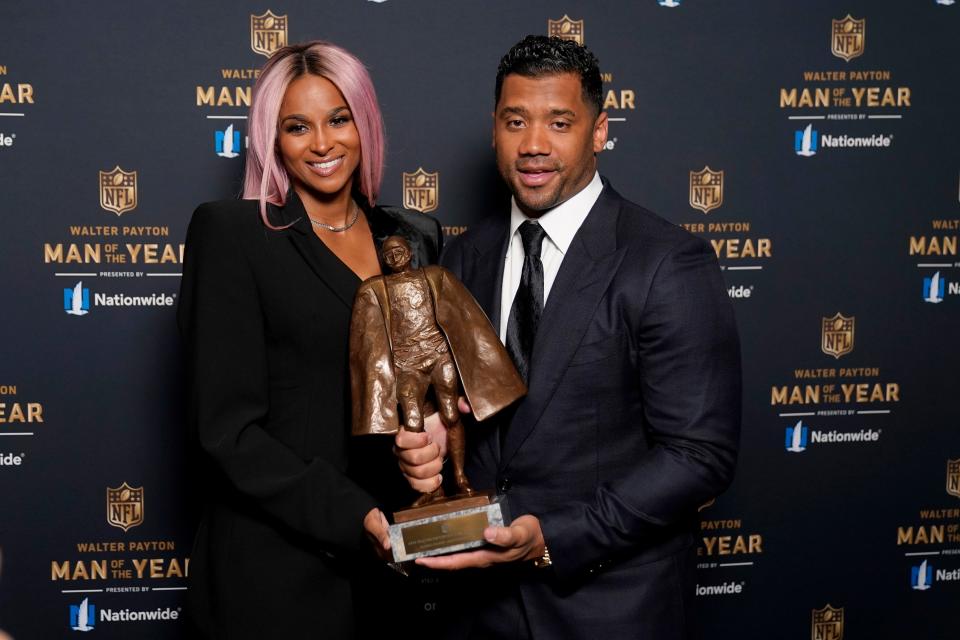 Seattle Seahawks quarterback Russell Wilson and his wife Ciara pose for a photo after Wilson won the Walter Payton NFL Man of the Year award at the NFL Honors ceremony as part of Super Bowl 55 on Friday, Feb. 5, 2021, in Tampa, Fla.