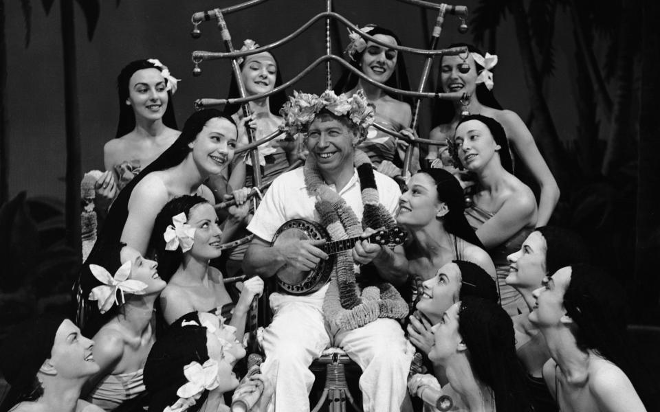 George Formby - with hoola girls - in 1951 - Getty