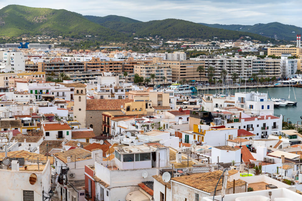 Ibiza, Spain - October 14th, 2021, Boats moored in the port of San Antonio de Portmany, Balearic Islands, Ibiza, Spain. View from above on a sunny autumn day.