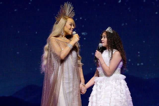 <p>Kevin Mazur/WireImage for MC</p> Carey performing with 12-year-old daughter Monroe on the tour