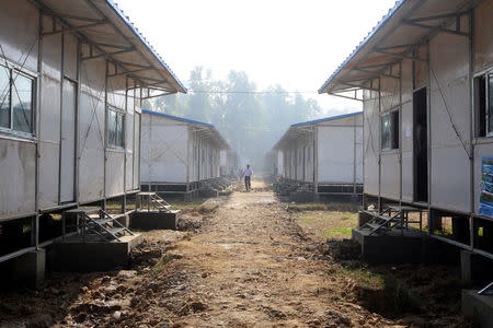 A man walks inside the camp set up by Myanmar's Social Welfare, Relief and Resettlement Minister to prepare for the repatriation of displaced Rohingyas, who fled to Bangladesh, outside Maungdaw in the state of Rakhine, Myanmar January 24, 2018. REUTERS/Stringer