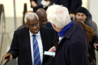 CAPTION CORRECTS SPELLING OF SURNAME Former president of the IAAF (International Association of Athletics Federations) Lamine Diack, left, arrives at the Paris courthouse, Monday, Jan. 13, 2020. One of the biggest sports corruption cases to reach court is being heard in Paris from Monday, with explosive allegations of a massive doping cover-up at the top of track and field. (AP Photo/Thibault Camus)