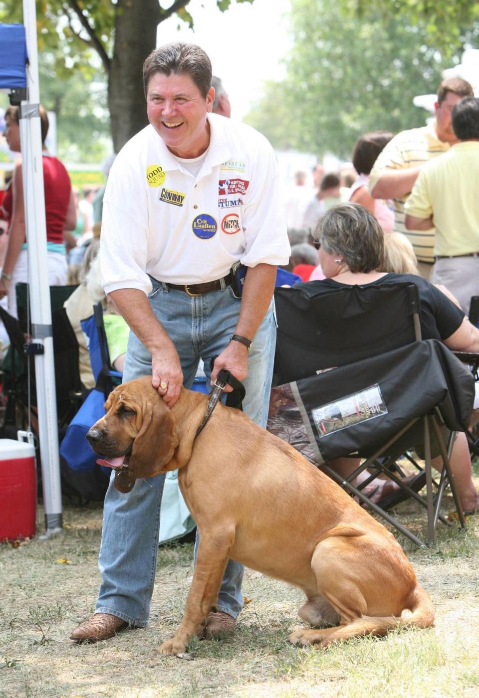 Attorney General Greg Stumbo walked around with blood hounds at the annual Fancy Farm political picnic held at the St. Jerome Catholic Church in Fancy Farm, Ky., Saturday, August 4, 2007. He said the blood hounds were “hunting for a real U.S. Senator” a reference to Mitch McConnell. Photo by Charles Bertram | Staff. 3699