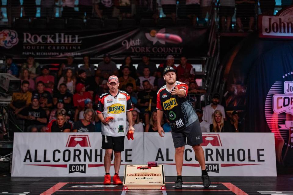 Matt Guy (left) and Mark Richards (right) compete during last year’s American Cornhole League World Championships.