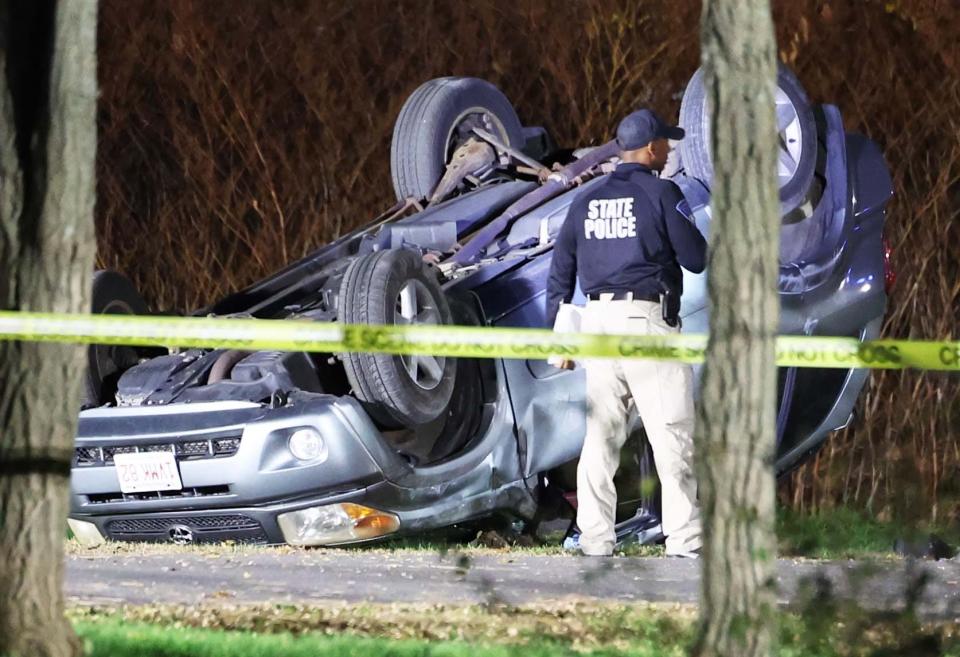 Brockton police and Massachusetts State Police investigate a rollover crash that left a man dead on Centre Street on Friday, Nov. 4, 2022.