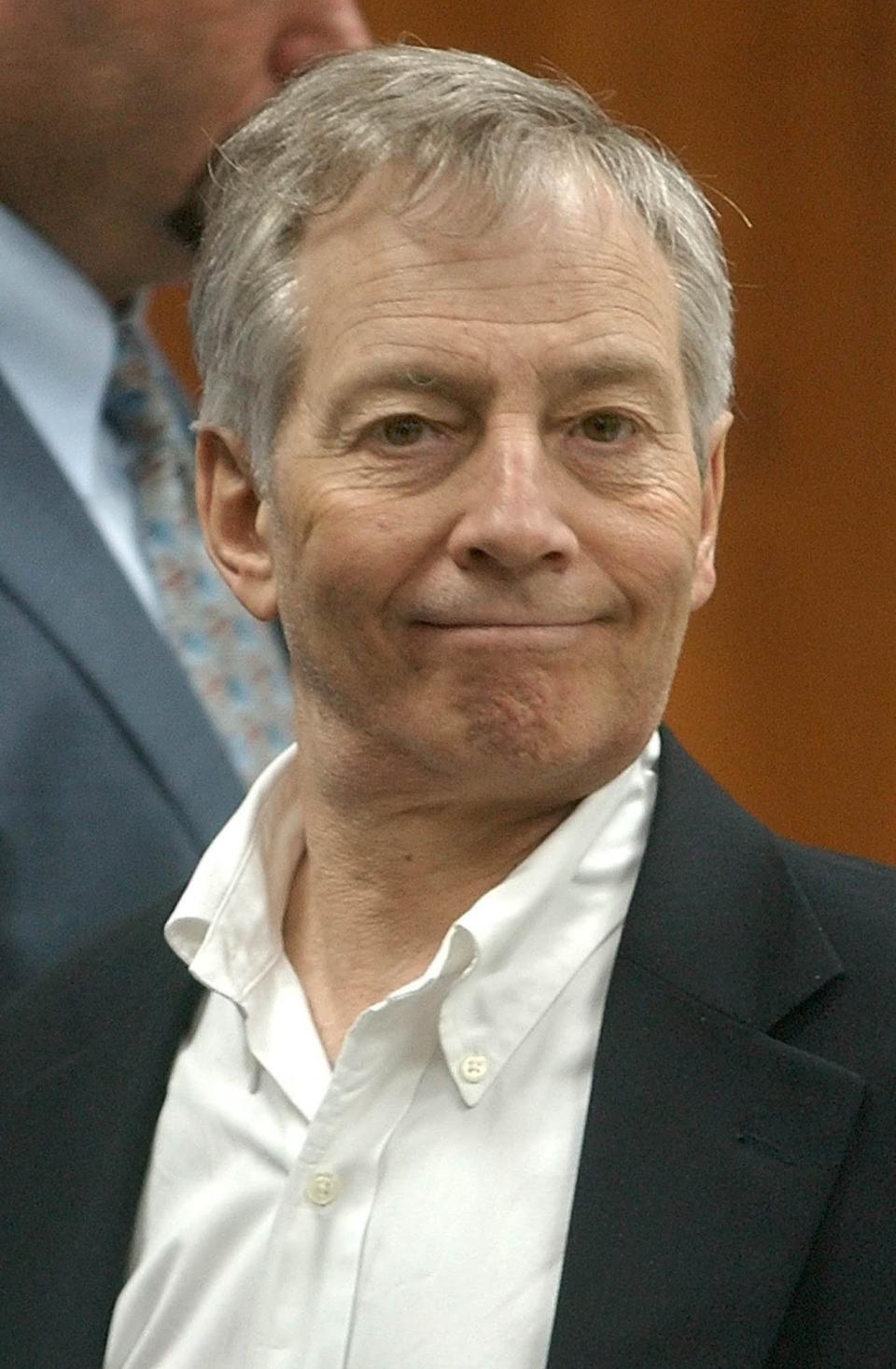 Murder defendant Robert Durst smiles for the camera at the end of the day's testimony in his murder trial in Galveston, Texas, Thursday, Sept. 25, 2003. An appeals court has ruled the $3 billion bail set for the bond jumping and evidence tampering charges against New York real estate heir Robert Durst are unconstitutionally excessive and should be reduced. 