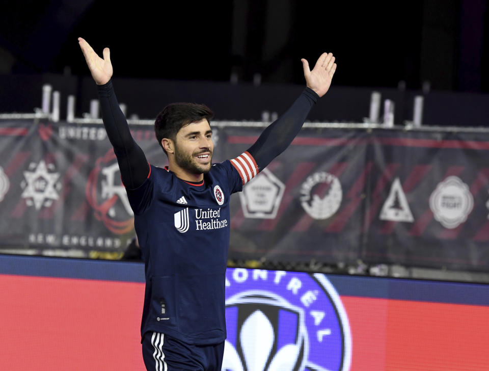 New England Revolution midfielder Carles Gil celebrates after a successful penalty kick in the first half of an MLS soccer match against CF Montreal, Saturday, April 8, 2023, in Foxborough, Mass. (AP Photo/Mark Stockwell)