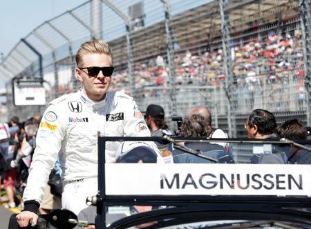 McLaren Formula One driver Kevin Magnussen of Denmark looks on during the drivers parade before the Australian F1 Grand Prix at the Albert Park circuit in Melbourne March 15, 2015. REUTERS/Mark Dadswell (AUSTRALIA - Tags: SPORT MOTORSPORT F1) - RTR4TDVT