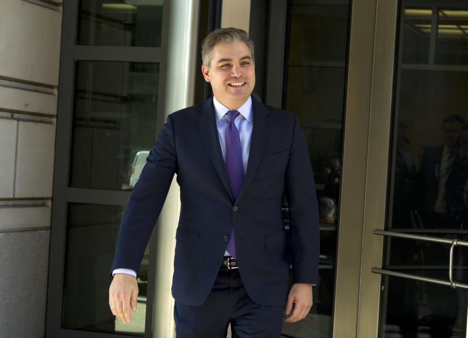 CNN's Jim Acosta walks out of the U.S. District Courthouse with a smile, Friday, Nov. 16, 2018, in Washington. U.S. District Court Judge Timothy Kelly ordered the White House to immediately return Acosta’s credentials. He found that Acosta was “irreparably harmed” and dismissed the government’s argument that CNN could send another reporter in Acosta’s place to cover the White House. (AP Photo/Jose Luis Magana)