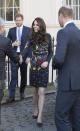 <p>The Duchess appeared perfectly coiffed at the ICA in London, wearing in a dark floral dress by Erdem (costing an eye watering £1050). Appearing in front of the media along with Princes William and Harry to outline her 2017 goals for Heads Together, Kate accessorised with brown buckled pumps and a burgundy suede clutch. </p><p><i>[Photo: Getty]</i></p>