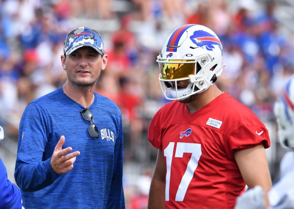 Buffalo Bills offensive coordinator Ken Dorsey talks with quarterback Josh Allen during training camp in July.