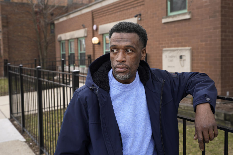 Brian Rodgers stands for a portrait outside of the St. Andrew's Court residence where he lives on Chicago's Westside Friday, Feb. 16, 2024, in Chicago. Rodgers, 50, struggled with homelessness for years after he was released from jail for a theft conviction. A Cook County judge rejected a ballot measure last week that would raise a one-time tax on luxury properties to fund services for homeless people in Chicago after objections from real estate and business groups. An appeal is pending as early voting begins. (AP Photo/Charles Rex Arbogast)