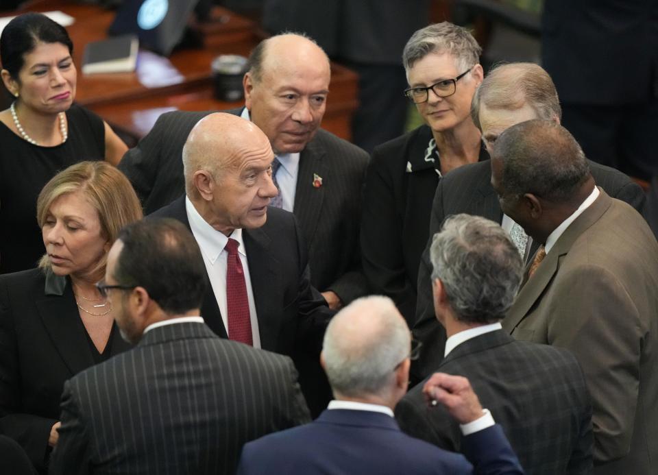Sen. Sarah Eckhardt, D - Austin, right, confers with other senators at the impeachment trial of Attorney General Ken Paxton at the Capitol on Thursday September 14, 2023.