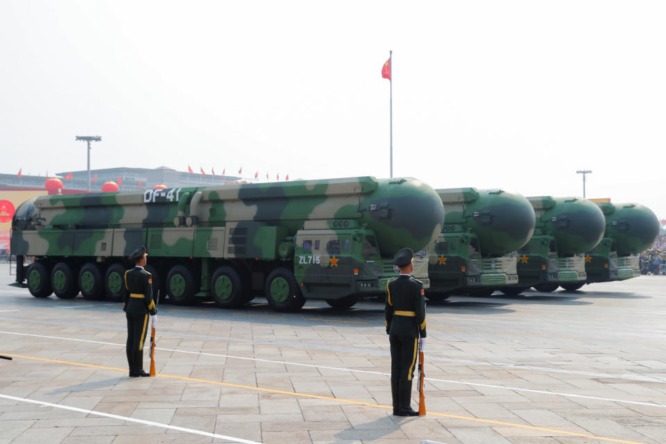 Military vehicles carrying DF-41 intercontinental ballistic missiles drive past Tiananmen Square during the military parade marking the 70th founding anniversary of the People's Republic of China (Picture: Reuters)