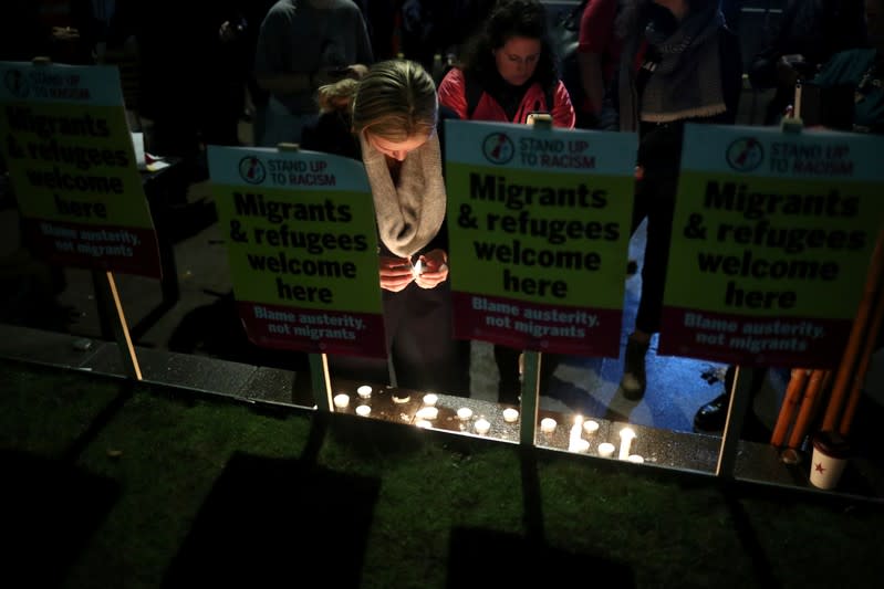 Anti-racism campaigners take part in a vigil, following the discovery of 39 bodies in a truck container, outside the Home Office in London