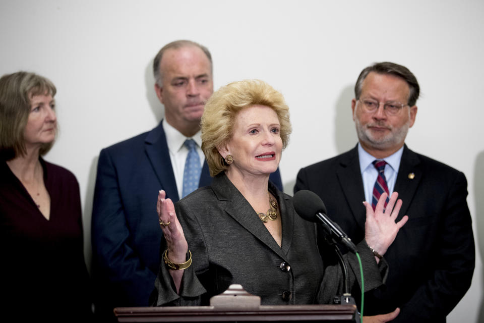 Sen. Debbie Stabenow, D-Mich., center, accompanied by Rep. Dan Kildee, D-Mich., second from left, Sen. Gary Peters., D-Mich., right, and Elizabeth Whelan, the sister of Paul Whelan, left, speaks at a news conference on Capitol Hill in Washington, Thursday, Sept. 12, 2019, to call on Congress to pass a resolution condemning the Russian government for detaining Paul Whelan. (AP Photo/Andrew Harnik)