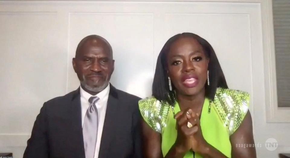 "Ma Rainey's Black Bottom" star Viola Davis, with husband Julius Tennon at her side, accepts the award for best female actor in a movie at the Screen Actors Guild Awards.