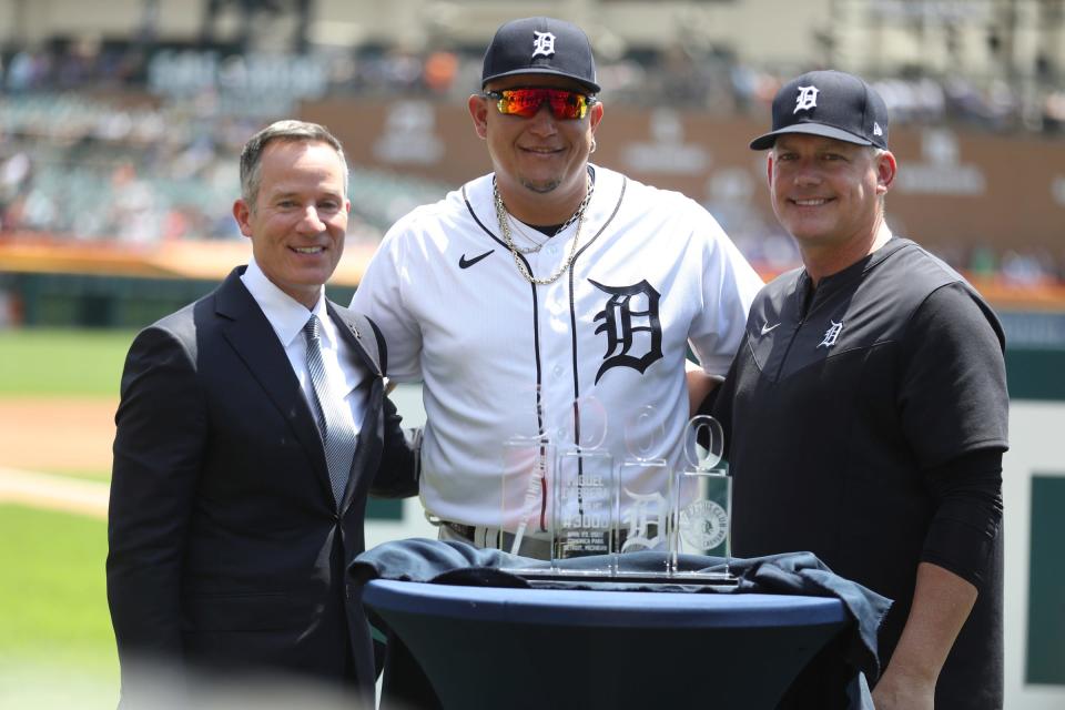 Detroit Tigers DH Miguel Cabrera (24) was honored for his 3,000 hits and 500 homers before the game against the Toronto Blue Jays on Sunday, June 12, 2022. Team owner Christopher Ilitch, Cabrera and manager A.J. Hinch pose with a trophy commemorating the occasion.