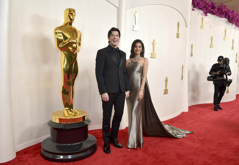 John Mulaney, left, and Olivia Munn arrive at the Oscars on Sunday, March 10, 2024, at the Dolby Theatre in Los Angeles. (Photo by Richard Shotwell/Invision/AP)