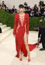 <p>Megan certainly turned heads when she arrived at the <a href="https://www.cosmopolitan.com/uk/fashion/celebrity/g37581121/met-gala-2021-red-carpet/?slide=16" rel="nofollow noopener" target="_blank" data-ylk="slk:2021 Met Gala;elm:context_link;itc:0;sec:content-canvas" class="link ">2021 Met Gala</a> wearing this fiery red Peter Dundas <a href="https://www.cosmopolitan.com/uk/fashion/celebrity/news/g4447/revealing-naked-met-gala-celebrity-dresses/" rel="nofollow noopener" target="_blank" data-ylk="slk:lace-up dress;elm:context_link;itc:0;sec:content-canvas" class="link ">lace-up dress</a>.</p>