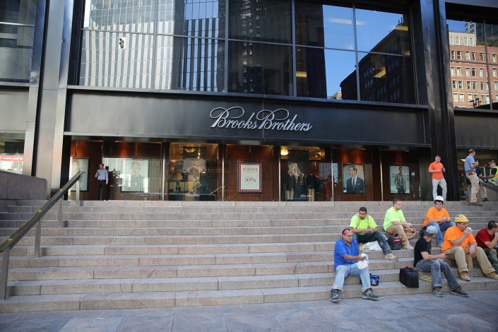 <p>Workers take a break on the steps of Brooks Brothers across from the World Trade Center site in New York City, Aug. 23, 2016. (Gordon Donovan/Yahoo News) </p>