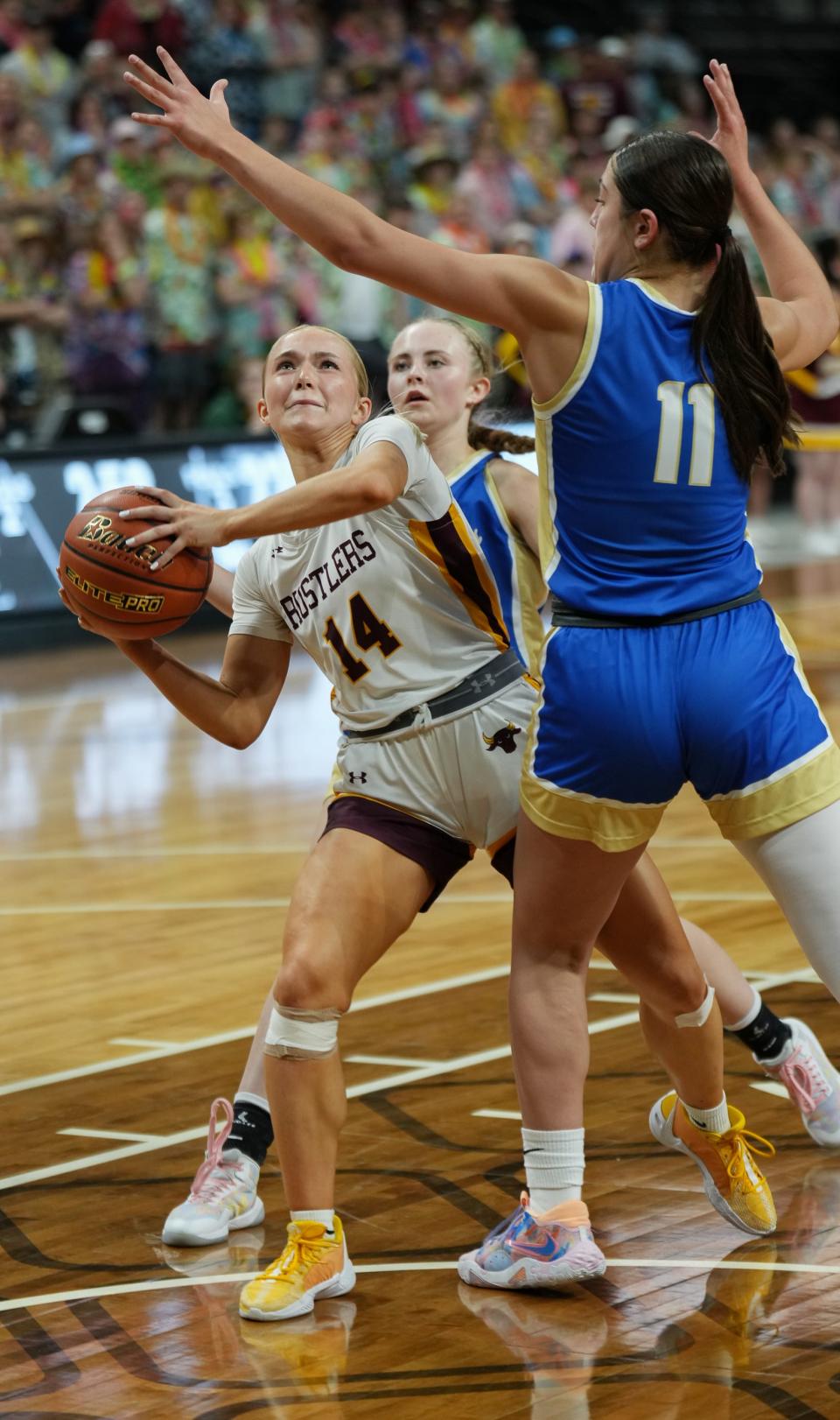 Ethan's Eva Lingemann (14) looks to shoot against Wall's Rhea Tucker during their first-round game in the state Class B girls baskeball tournament on Thursday, March 7, 2024 in the Summit Arena at The Monument in Rapid City.