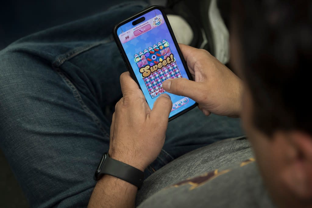 The Candy Crush Saga is a tile-matching game with a confectionary motif where players are awarded “sugar bonuses and tasty candy combos,” per the app’s description. Stefano Giovannini for N.Y.Post