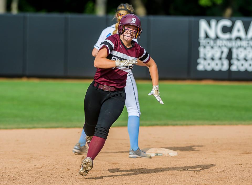 Hailee Kara of Buchanan rounds second base after hitting a drive that bounced off the right field foul pole and back into the park in the second inning of the Bucks' Division 3 state final game with Richmond Saturday June 19, 2021 at Secchia Stadium on the Michigan State campus in East Lansing, Mich. Kara was awarded an inside the park home run providing Buchanan's only run of the game.