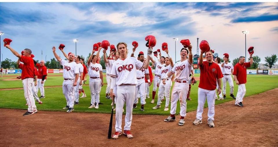 Okotoks Dawgs players salute fans during an earlier game in their 2023 playoff run.