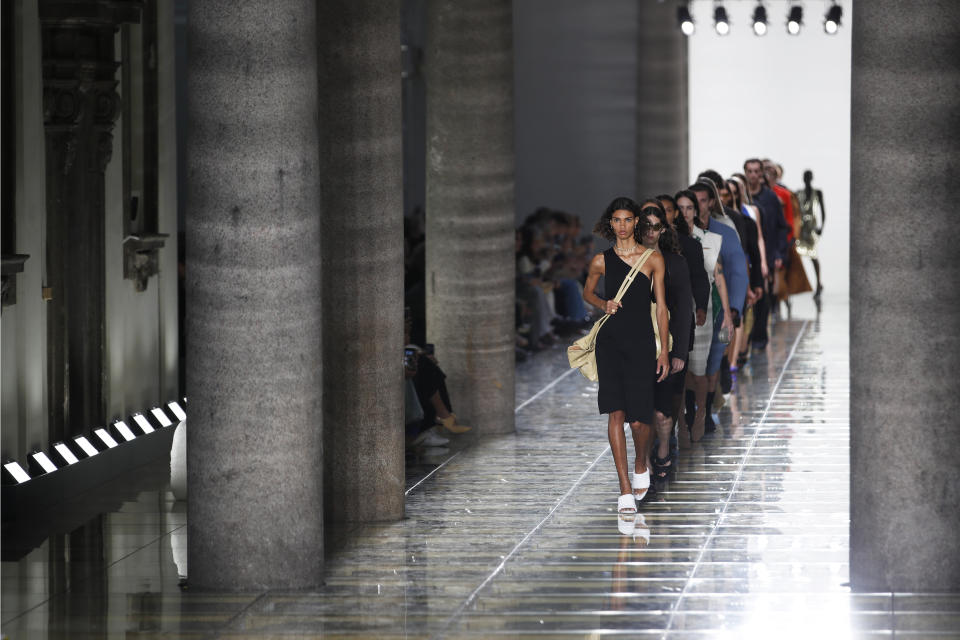 Models wear creations as part of the Bottega Veneta Spring-Summer 2020 collection, unveiled during the fashion week, in Milan, Italy, Thursday, Sept. 19, 2019. (AP Photo/Antonio Calanni)