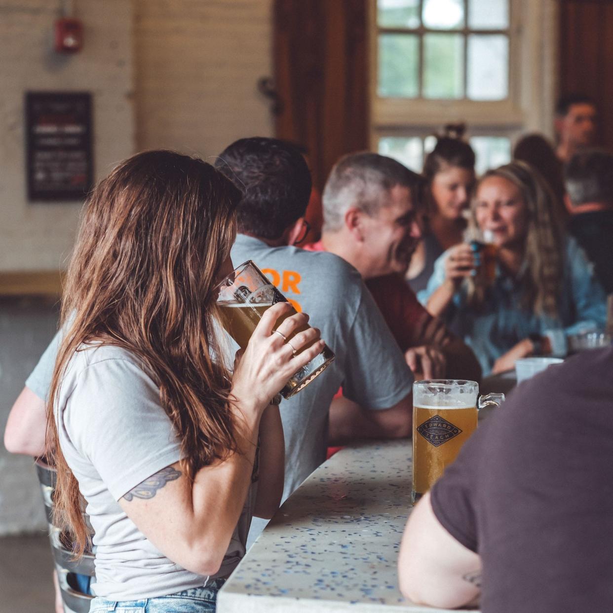 Patrons at Edward Teach Brewing in Wilmington.