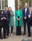 <p>The Duchess, always on theme, chose a Kelly green coat and sweater to attend a <a href="https://www.townandcountrymag.com/society/tradition/a37948170/kate-middleton-green-coat-prince-william-generation-earthshot-photos/" rel="nofollow noopener" target="_blank" data-ylk="slk:Generation Earthshot event;elm:context_link;itc:0;sec:content-canvas" class="link ">Generation Earthshot event</a>, encouraging students to think about ideas for repairing the planet. She paired the green items with black, wide leg trousers. </p>