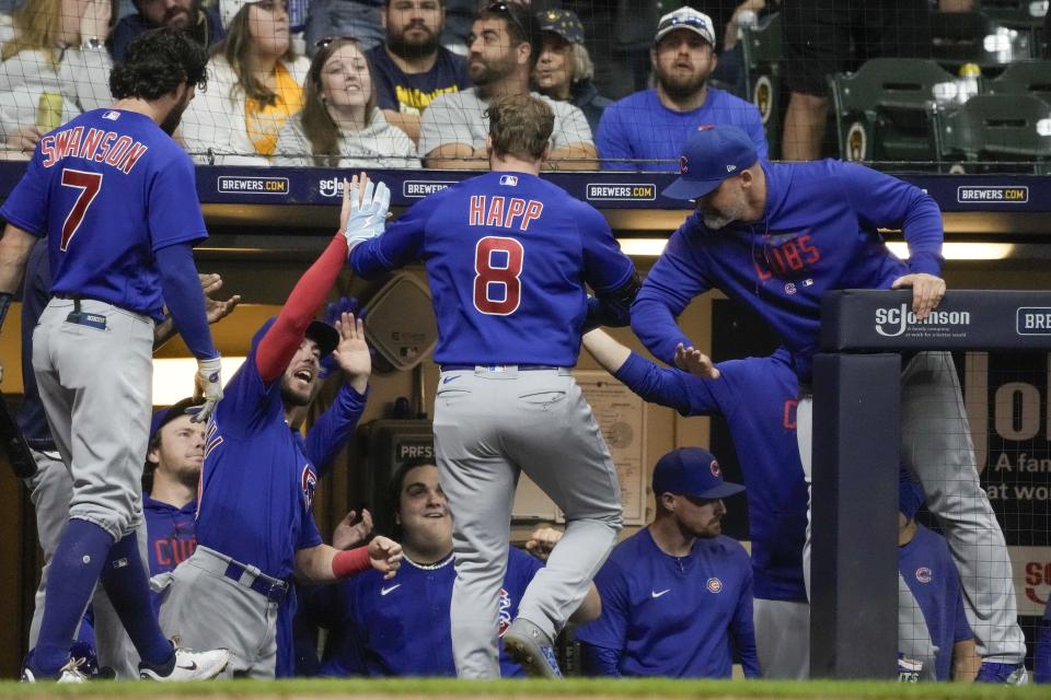 Chicago Cubs' Ian Happ is congratulated after hitting a home run during the ninth inning of a baseball game against the Milwaukee Brewers Friday, Sept. 29, 2023, in Milwaukee. (AP Photo/Morry Gash)