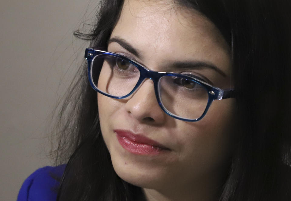 In this Jan. 8, 2019 photo, 28-year-old lawyer Francys Valdivia Machado, president of the Madres de Abril Association, speaks to Associated Press journalists in an undisclosed location in Mexico, where she is in hiding. In June, two men dressed in T-shirts like those worn by the pro-Ortega goons who violently targeted the student protesters came to her home and law office looking for her. She and her family moved around Managua for weeks before eventually heading to Mexico. (AP Photo)