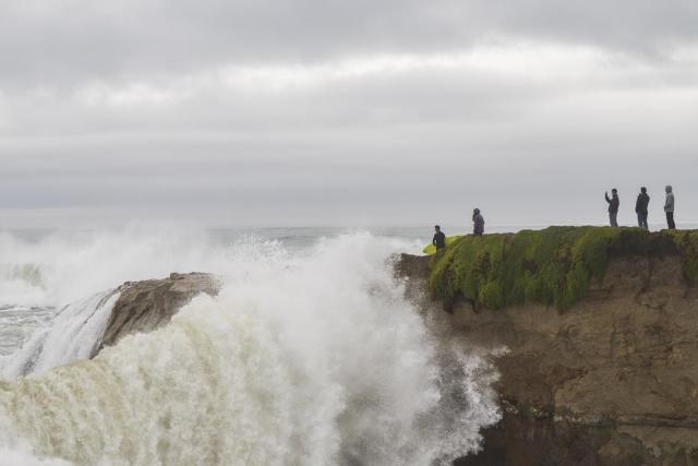 Huge surf pounds beaches on West Coast and in Hawaii with some low