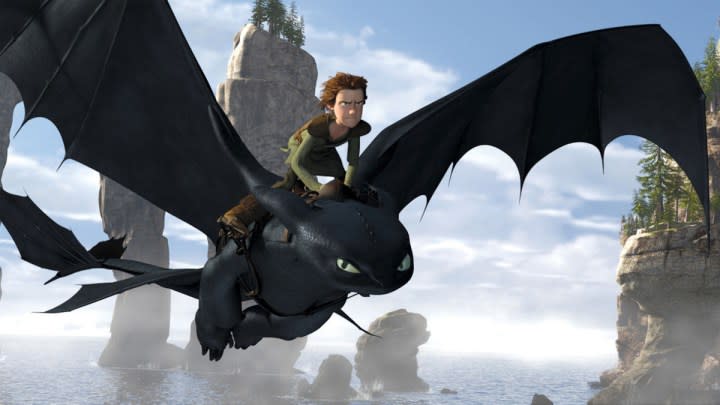 Hiccup rides Toothless in How To Train Your Dragon.