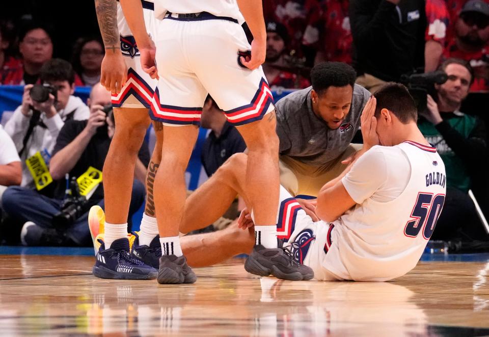 March 22, 2024, Brooklyn, NY, USA; Florida Atlantic Owls center Vladislav Goldin (50) reacts after an apparent injury against the Northwestern Wildcats in the first round of the 2024 NCAA Tournament at the Barclays Center. Mandatory Credit: Robert Deutsch-USA TODAY Sports