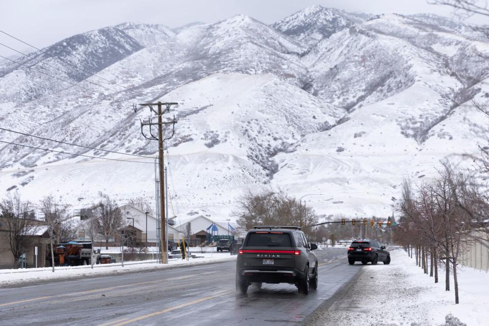 Cars are pictured driving after an overnight storm at in Draper on Wednesday, Jan. 10, 2024. | Marielle Scott, Deseret News