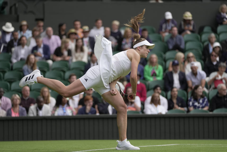 Ukraine's Elina Svitolina serves to Venus Williams of the US in a first round women's singles match on day one of the Wimbledon tennis championships in London, Monday, July 3, 2023. (AP Photo/Kin Cheung)